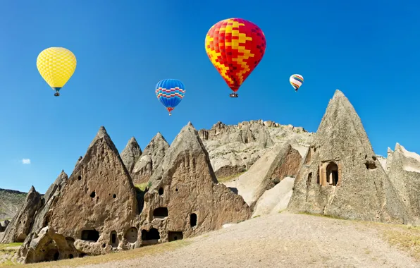 Картинка небо, солнце, воздушные шары, камни, скалы, разноцветные, Турция, Cappadocia, аэростаты